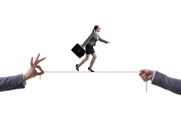 Businesswoman walking on tight rope in business concept - Photo, Image