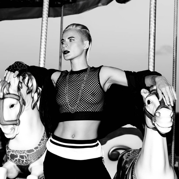 Swag style girl on carousel in sexy outfit club clothes - Foto, Imagem