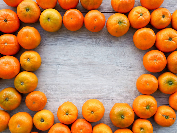 fresh Mandarin oranges as a background, cover, space for text - Fotó, kép