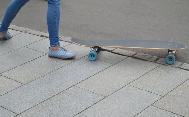 skateboarder, skateboarding female feet in the skatepark - Фото, зображення