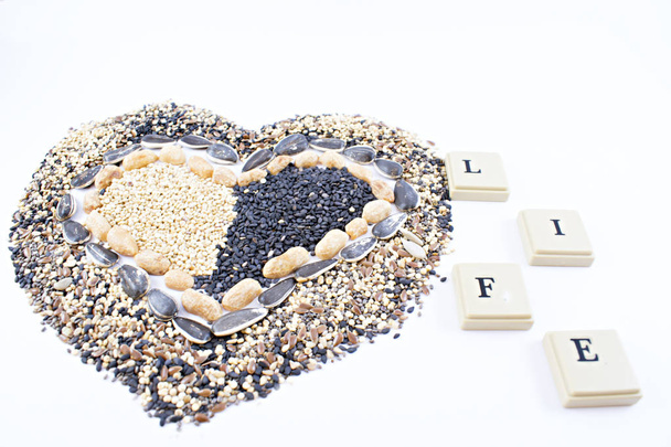 Heart made of seeds with chips. - Photo, Image