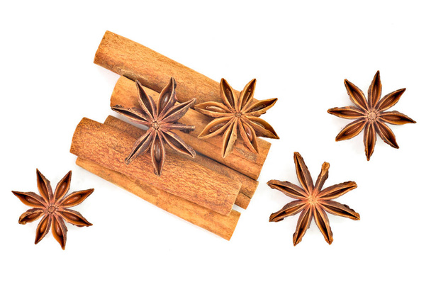Star anise and cinnamon sticks herb isolates on white back ground - Photo, Image