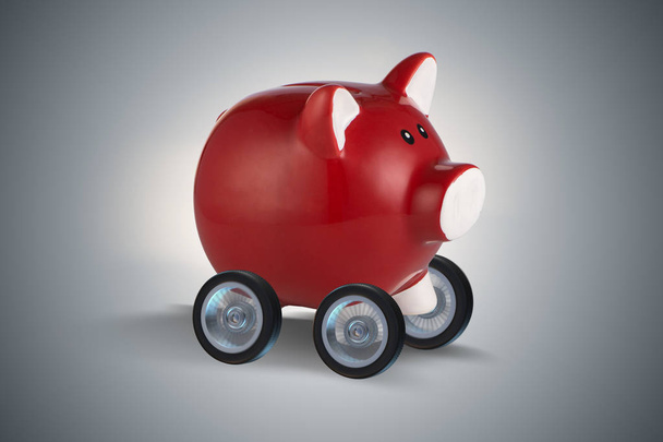 Piggybank afastado em rodas de renderização 3d
 - Foto, Imagem