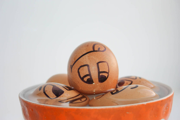 Eggs with painted face. Photo for your design. - Foto, Bild