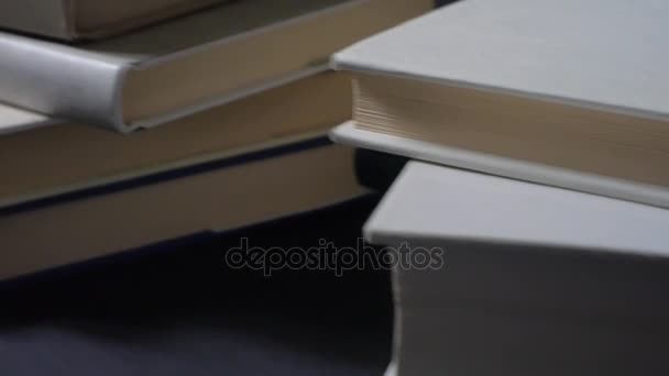 Stacks of folded books. - Footage, Video