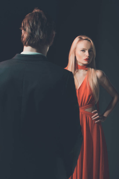 woman, blonde girl in red and man, couple in love - Foto, imagen