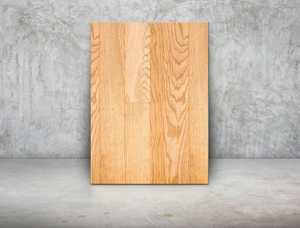 Blank wood block frame leaning at grunge grey concrete wall and  - Foto, imagen