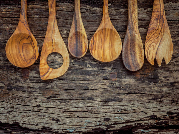 Various wooden cooking utensils border. Wooden spoons and wooden - Photo, Image