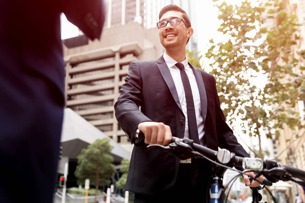 Young businessmen with a bike - Фото, зображення