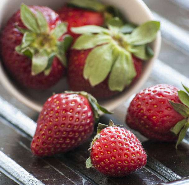 strawberry on a dark wood background - Photo, image