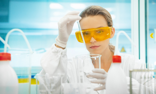Woman in lab with pipettes and equipments, researcher - Photo, Image