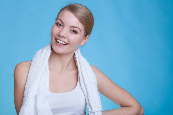 Woman with a towel around her shoulders smiling - Foto, Imagem
