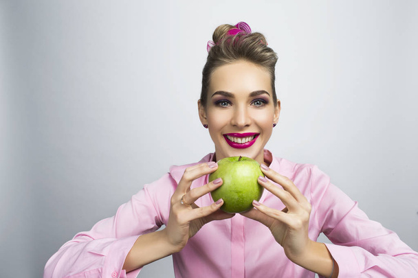 Funny smiling woman hold apple - Фото, изображение