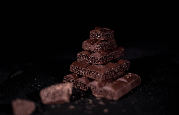 Stack of black pore chocolate  - Foto, immagini