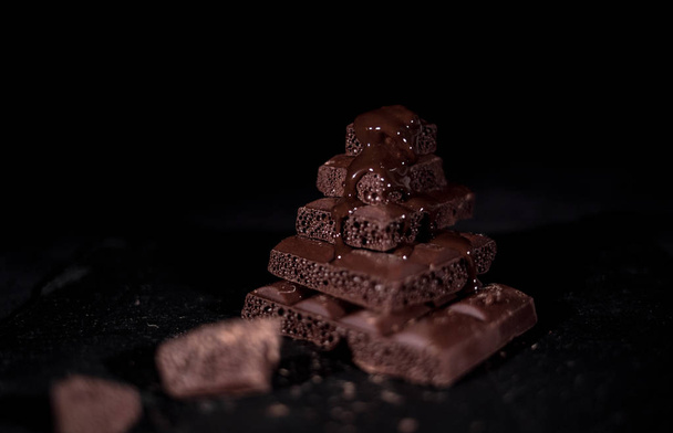 Stack of black pore chocolate  - Photo, Image