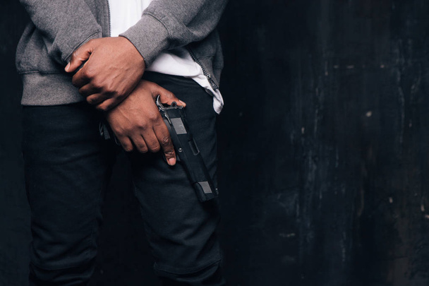 Unrecognizable armed black criminal man - Valokuva, kuva