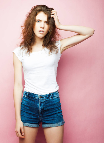Fashion Model, Fashion, Teenage Girls. Posing over pink background. - Photo, image