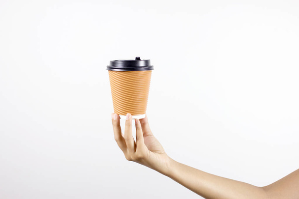 woman holding paper cup of hot coffee with white background. - Фото, зображення