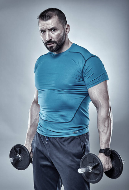 Fitness trainer with dumbbells - Fotó, kép