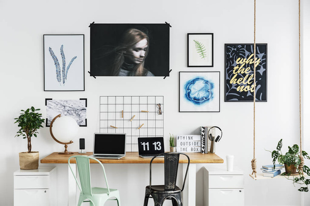 Posters on a wall in home office - Foto, imagen
