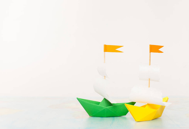 Two coloured paper boat. Place for text. - Fotó, kép