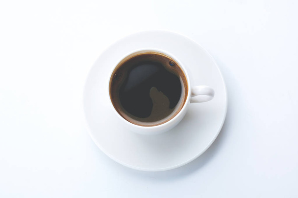 White cup of coffee on white background - 写真・画像
