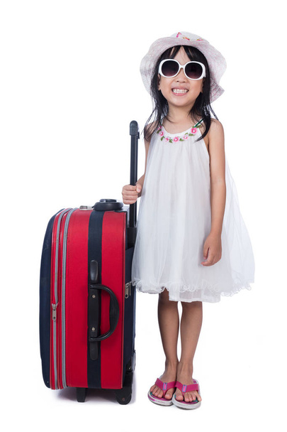 Onnellinen aasialainen pieni kiinalainen tyttö matkalaukku
 - Valokuva, kuva