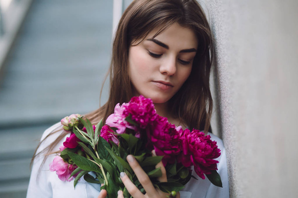 Woman holding flowers peonies bouquet - Photo, Image