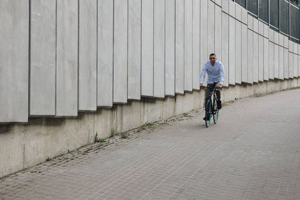 Man riding bicycle - Фото, изображение