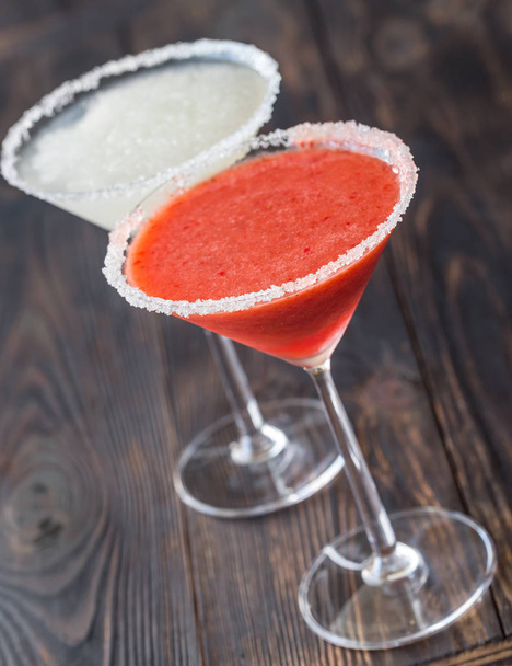 Glasses of lime and strawberry margarita cocktail - Photo, Image