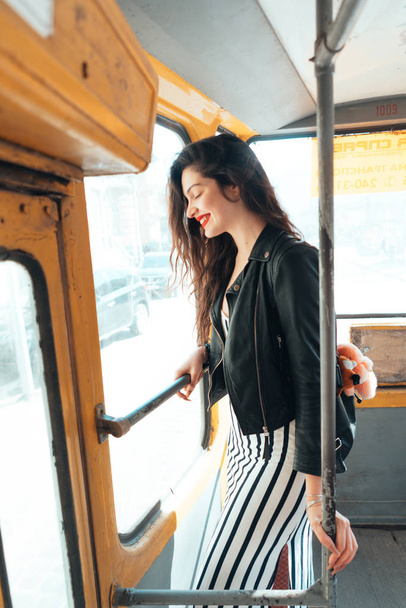 Woman traveling inside the tram - Photo, Image