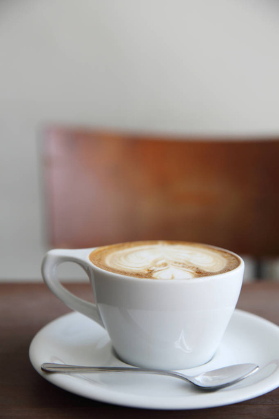 cappuccino coffee on wood background - 写真・画像