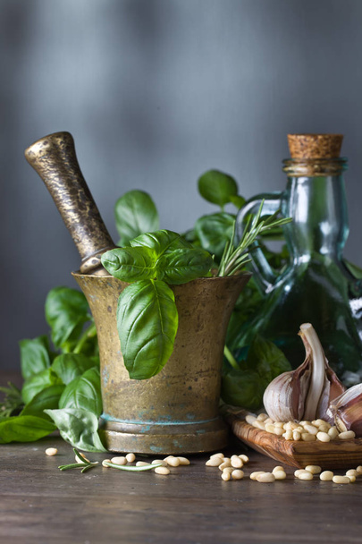 Ingredients for making pesto on a wooden table . - Photo, Image