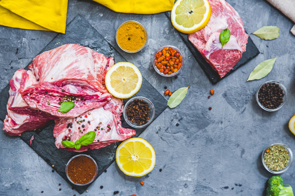 Raw fresh meat steak with spices on grey background - Φωτογραφία, εικόνα