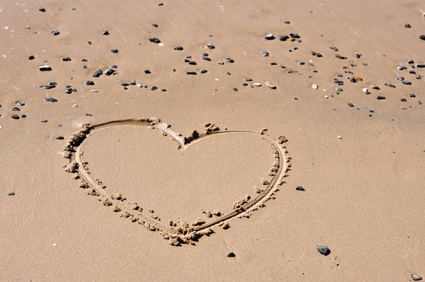 A heart shape drawn in the sand - Photo, Image