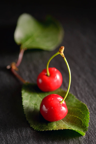 cherries with leaf on ardesia  plate - Photo, Image