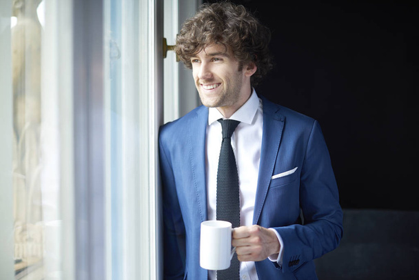 businessman with cup of coffee - Фото, зображення