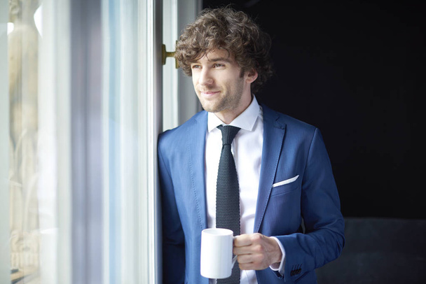 businessman with cup of coffee - Zdjęcie, obraz