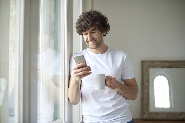 man using cellphone and text messaging - Zdjęcie, obraz