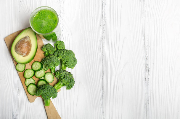 Green smoothie from broccoli, avocado and cucumber with ingredie - Photo, Image