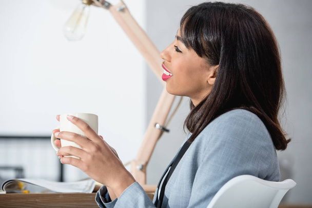 Businesswoman drinking coffee  - Photo, image