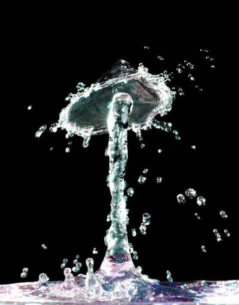 Színes folyékony splash-fekete háttér - Fotó, kép