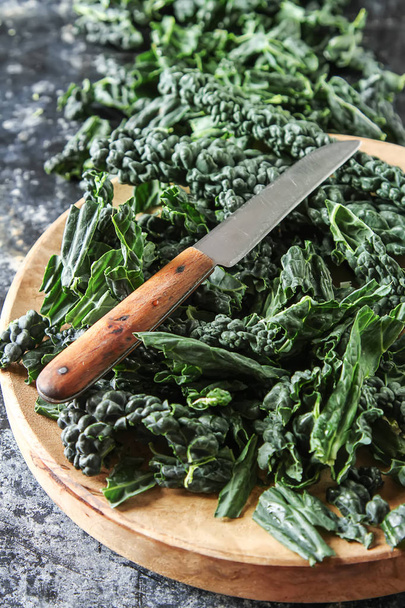 Fresh leaves of Kale salad. Italian Cuisine. Dark background. - Foto, imagen