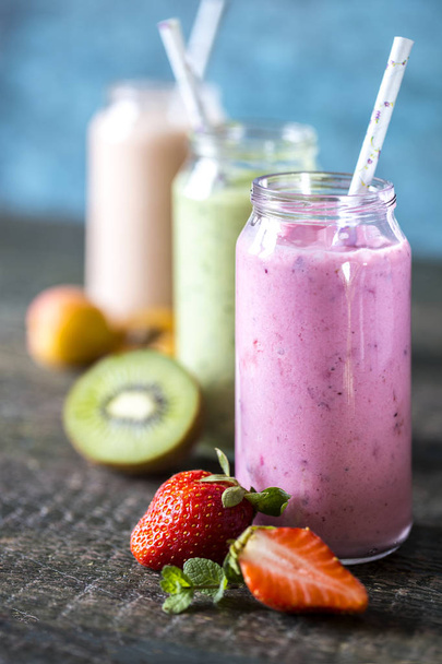 smoothies with fruit, strawberries, kiwi, berries, bananana, lim - Photo, image