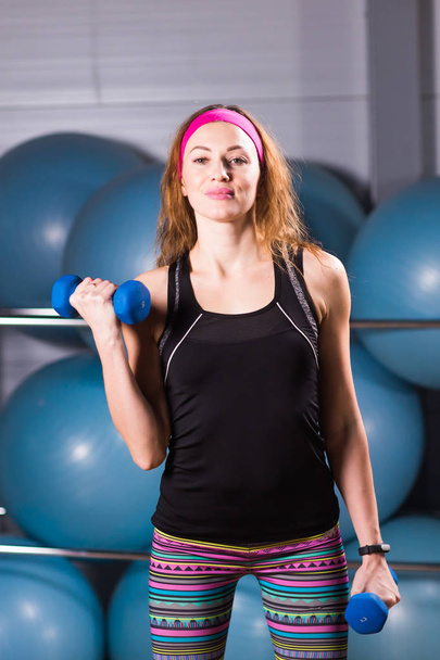 fitness woman workout with dumbbell. - Valokuva, kuva