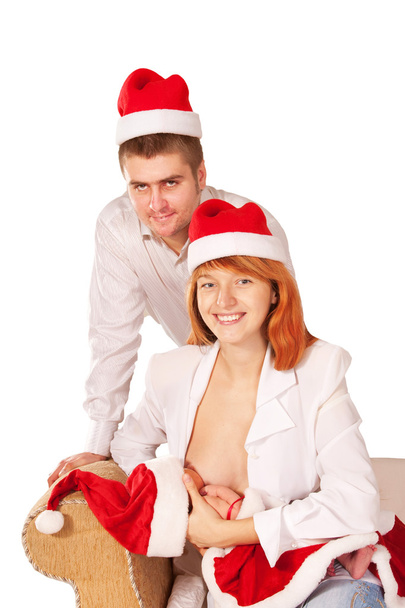 gelukkige familie in santa claus hoeden. Homemade christmas - Foto, afbeelding