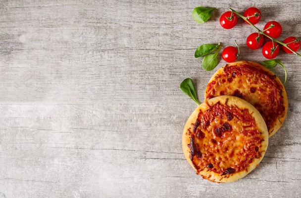 Mini margarita pizza. Italian food. Simple background. Fast food - Photo, image