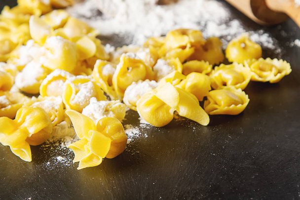 Italian traditional food. Home-made ravioli with cheese and herb - Zdjęcie, obraz