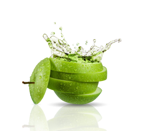 Green apple juice splashing with its fruits isolated - Photo, Image