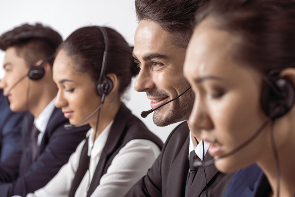 Call center operators in headsets  - Photo, Image